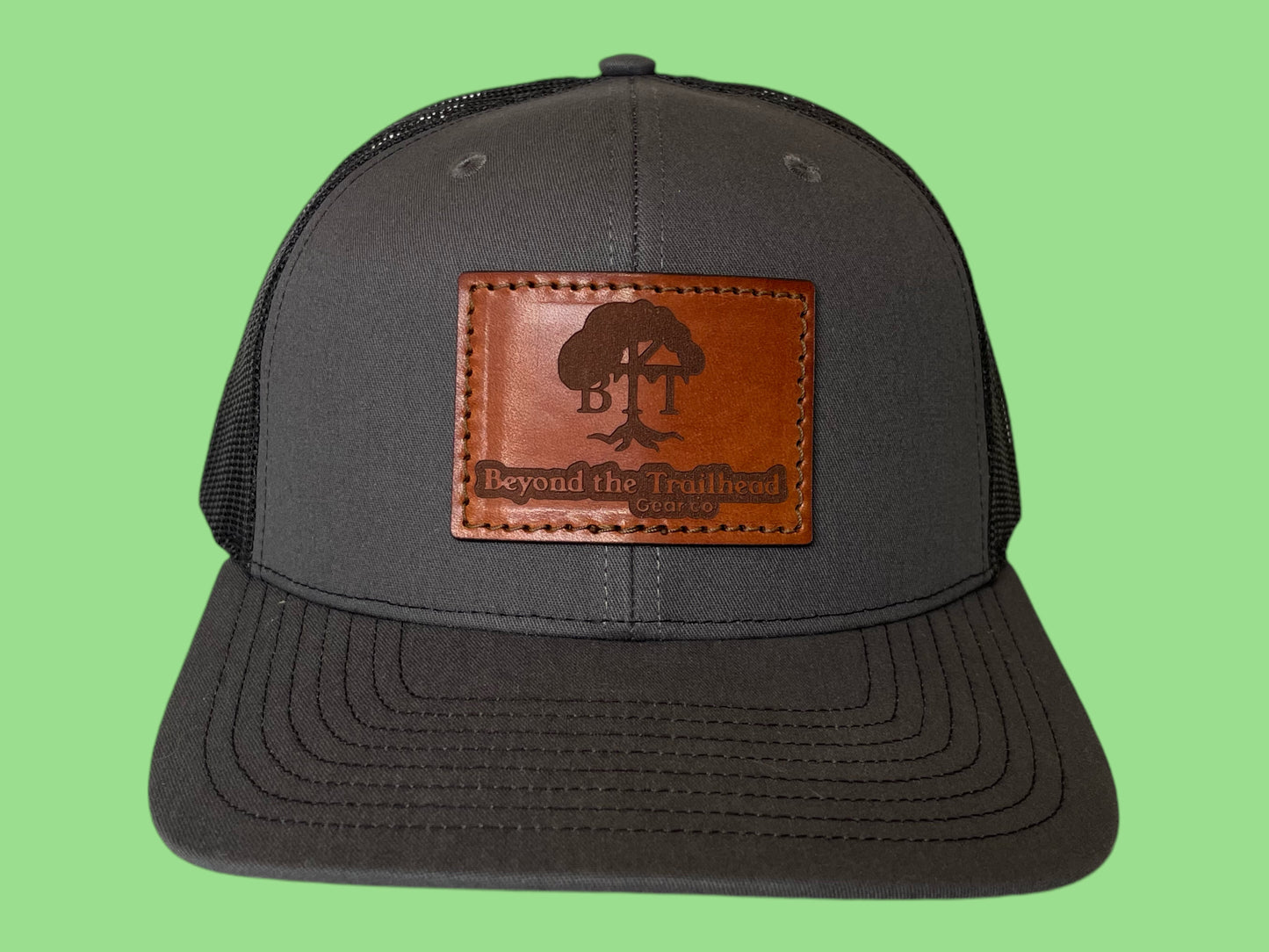 Beyond the Trailhead™ Logo Trucker Hat |  Charcoal/Black